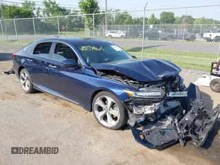 2018 Honda Accord Touring with VIN 1HGCV1F90JA134479, listed as a IAAI auction lot 42574615 with 83,874 mi miles and . Bid and sale history available at DreamBid. Image 1.