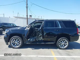 2016 Chevrolet Tahoe LT z VIN 1GNSCBKC7GR311313, wystawiony jako IAAI lot #42303467 z przebiegiem 90 889 mil mil oraz . Historia ofert i sprzedaży dostępna na DreamBid. Obrazek 15.