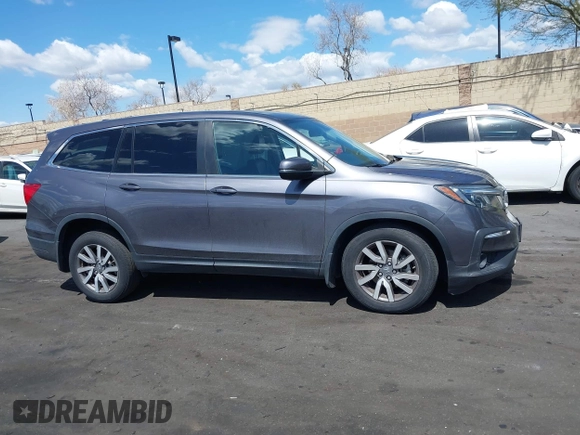2021 Honda Pilot EX-L with VIN 5FNYF5H57MB046740, listed as a IAAI auction lot 41943366 with 31,198 mi miles and . Bid and sale history available at DreamBid. Image 14.