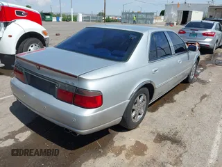 2003 Cadillac Seville Luxury SLS z VIN 1G6KS54Y43U214795, wystawiony jako IAAI lot #42348542 z przebiegiem 144 438 mil mil oraz . Historia ofert i sprzedaży dostępna na DreamBid. Obrazek 4.