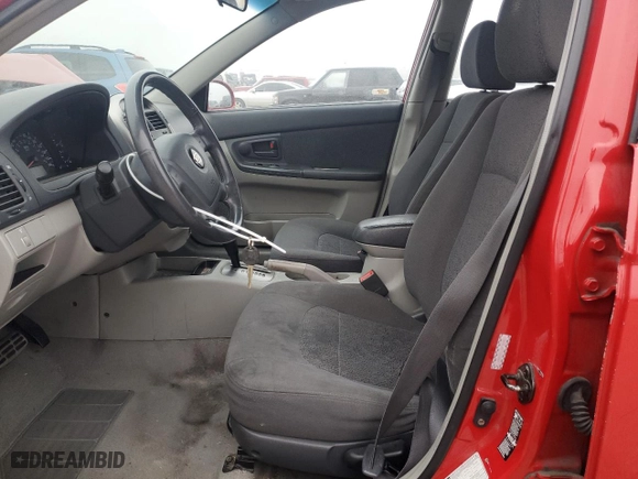 2005 Kia Spectra with VIN KNAFE161555106792, listed as a Copart auction lot 82832374 with 101,747 mi miles and Salvage Title. Bid and sale history available at carsss.com. Image 7.