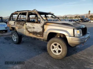 1998 Jeep Grand Cherokee Limited with VIN 1J4GZ88Z5WC119542, listed as a Copart auction lot 84562304 with 0 mi miles and Non Repairable. Bid and sale history available at carsss.com. Image 4.