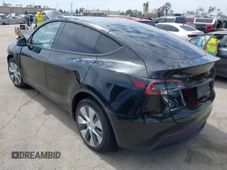 2023 Tesla Model Y Long Range z VIN 7SAYGDEE2PF863200, wystawiony jako IAAI lot #41805168 z przebiegiem 25 480 mil mil oraz . Historia ofert i sprzedaży dostępna na DreamBid. Obrazek 3.
