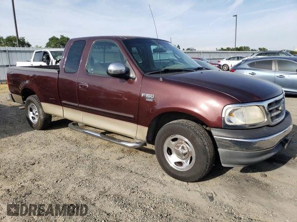 2000 Ford F-150 with VIN 1FTRX17W5YKA50203, listed as a Copart auction lot 54734615 with Not Provided miles and Salvage Title. Bid and sale history available at DreamBid. Image 4.