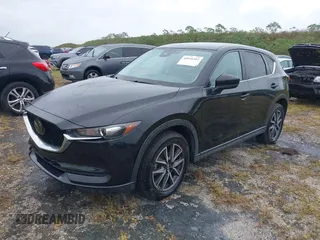 2018 Mazda CX-5 Touring with VIN JM3KFACM0J0315739, listed as a IAAI auction lot 40516262 with 60,727 mi miles. Bid and sale history available at carsss.com. Image 2.