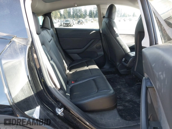 2021 Tesla Model Y Long Range with VIN 5YJYGDEE9MF301903, listed as a IAAI auction lot 42004007 with 26,740 mi miles. Bid and sale history available at carsss.com. Image 8.