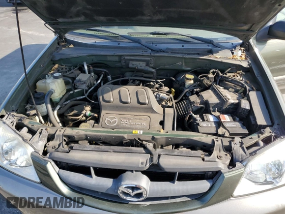 2002 Mazda Tribute LX with VIN 4F2YU08112KM16716, listed as a Copart auction lot 55095645 with 113,885 mi miles and Salvage Title. Bid and sale history available at DreamBid. Image 12.