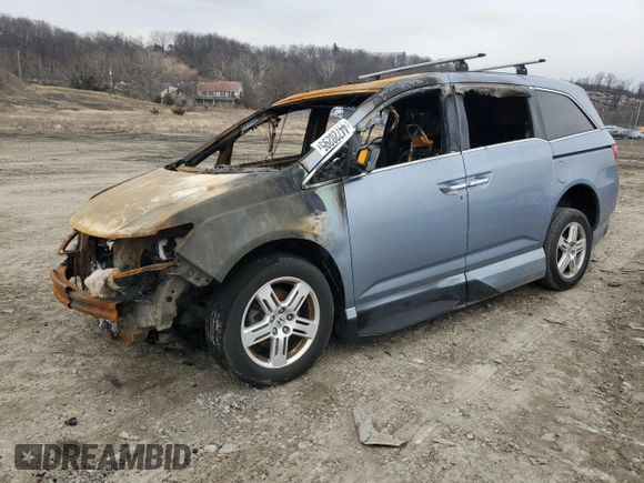 2012 Honda Odyssey Touring with VIN 5FNRL5H92CB127191, listed as a Copart auction lot 44720295 with Not Provided miles and Salvage Title. Bid and sale history available at DreamBid. Image 1.