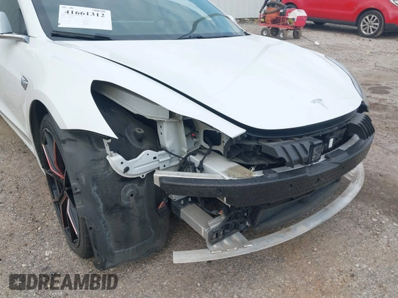 2019 Tesla Model 3 Mid Range with VIN 5YJ3E1EA8KF472540, listed as a IAAI auction lot 41661312 with 75,575 mi miles and . Bid and sale history available at DreamBid. Image 6.