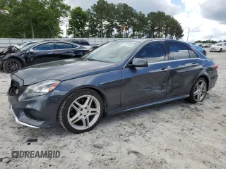 2014 Mercedes-Benz E 350 Sport with VIN WDDHF5KB9EA825975, listed as a Copart auction lot 55427505 with 134,668 mi miles and Salvage title. Bid and sale history available at DreamBid. Image 1.
