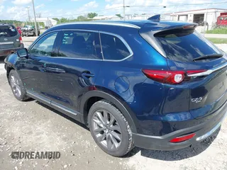 2021 Mazda CX-9 Grand Touring with VIN JM3TCBDY4M0513099, listed as a IAAI auction lot 42563530 with 76,006 mi miles and . Bid and sale history available at DreamBid. Image 3.