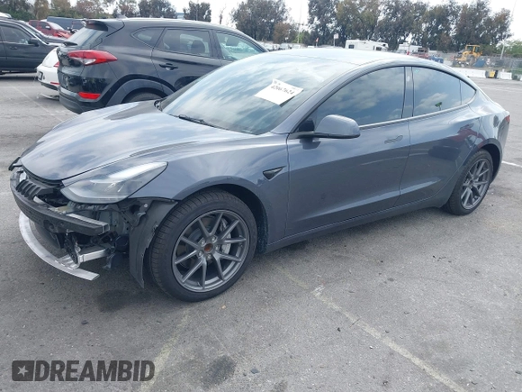 2023 Tesla Model 3 with VIN 5YJ3E1EA4PF410060, listed as a IAAI auction lot 42067624 with 59,934 mi miles and . Bid and sale history available at DreamBid. Image 2.