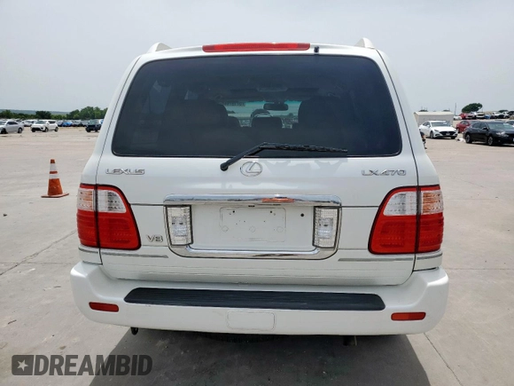 2004 Lexus LX 470 z VIN JTJHT00W743542910, wystawiony jako Copart lot #57187445 z przebiegiem 236 985 mil mil oraz Szkoda całkowita • Salvage title. Historia ofert i sprzedaży dostępna na DreamBid. Obrazek 6.