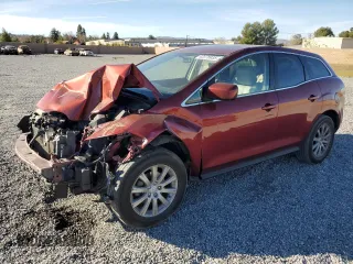 2012 Mazda CX-7 i Touring z VIN JM3ER2CM2C0421090, wystawiony jako Copart lot #42378935 z przebiegiem 106 702 mil mil oraz Szkoda całkowita • Salvage title. Historia ofert i sprzedaży dostępna na DreamBid. Obrazek 1.