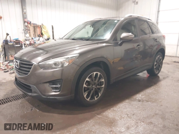 2016 Mazda CX-5 Grand Touring with VIN JM3KE4DY0G0732843, listed as a IAAI auction lot 41520889 with 149,798 mi miles. Bid and sale history available at carsss.com. Image 17.