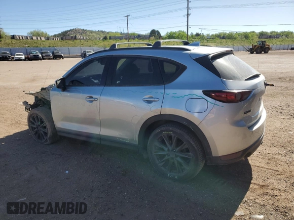 2019 Mazda CX-5 Grand Touring with VIN JM3KFADM6K0543888, listed as a Copart auction lot 56310785 with 112,737 mi miles and Salvage title. Bid and sale history available at DreamBid. Image 2.