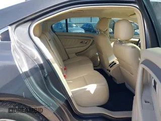 2015 Ford Taurus SEL with VIN 1FAHP2E87FG156969, listed as a IAAI auction lot 42506157 with 99,184 mi miles and . Bid and sale history available at DreamBid. Image 8.