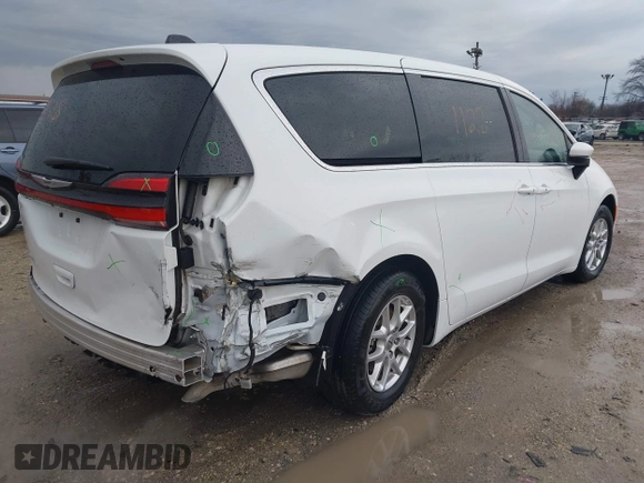 2023 Chrysler Pacifica Touring L with VIN 2C4RC1BG6PR520945, listed as a IAAI auction lot 41591128 with 70,351 mi miles and . Bid and sale history available at DreamBid. Image 4.