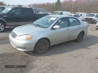 2003 Toyota Corolla CE with VIN JTDBR32E930004139, listed as a IAAI auction lot 42113619 with 209,120 mi miles. Bid and sale history available at carsss.com. Image 2.
