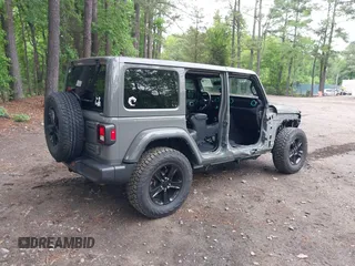 2021 Jeep Wrangler Unlimited Sahara with VIN 1C4HJXEG0MW703812, listed as a IAAI auction lot 42186089 with 50,349 mi miles and . Bid and sale history available at DreamBid. Image 4.