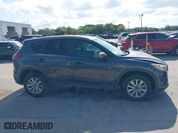 2015 Mazda CX-5 Touring with VIN JM3KE2CY9F0468199, listed as a IAAI auction lot 42099253 with 110,909 mi miles and . Bid and sale history available at carsss.com. Image 13.