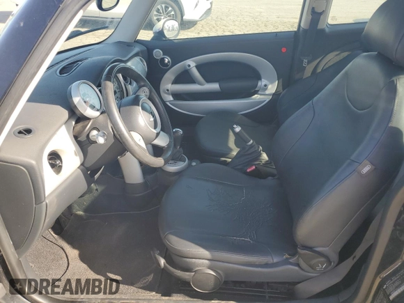 2004 MINI Hardtop with VIN WMWRC33464TJ62893, listed as a Copart auction lot 51905565 with 141,958 mi miles and Salvage Title. Bid and sale history available at DreamBid. Image 7.