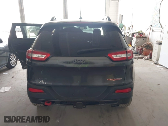 2016 Jeep Cherokee Trailhawk with VIN 1C4PJMBS0GW169184, listed as a IAAI auction lot 42255346 with 152,802 mi miles and . Bid and sale history available at DreamBid. Image 16.