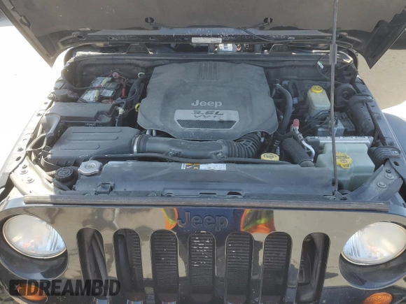 2013 Jeep Wrangler Sahara with VIN 1C4AJWBG8DL602065, listed as a Copart auction lot 52082535 with 110,727 mi miles and Salvage title. Bid and sale history available at DreamBid. Image 11.