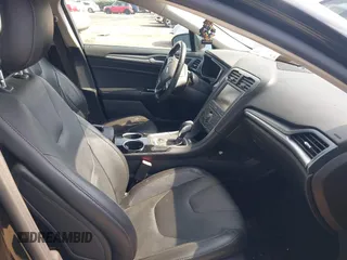 2013 Ford Fusion Titanium Hybrid with VIN 3FA6P0RU7DR355481, listed as a IAAI auction lot 41814003 with 177,789 mi miles. Bid and sale history available at carsss.com. Image 5.