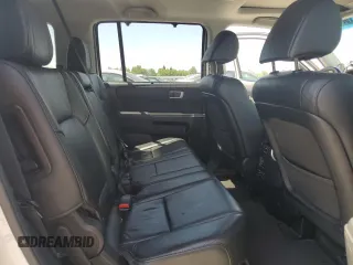 2014 Honda Pilot Touring z VIN 5FNYF4H9XEB047993, wystawiony jako Copart lot #57518705 z przebiegiem 159 809 mil mil oraz Szkoda całkowita • Salvage title. Historia ofert i sprzedaży dostępna na DreamBid. Obrazek 11.