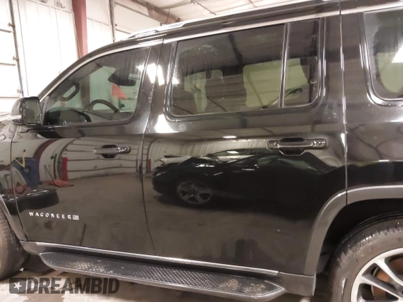 2022 Jeep Wagoneer Series II with VIN 1C4SJVBT5NS127476, listed as a IAAI auction lot 41807474 with 48,703 mi miles and . Bid and sale history available at DreamBid. Image 15.