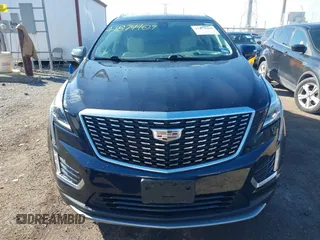 2021 Cadillac XT5 FWD Premium Luxury z VIN 1GYKNCRS2MZ141440, wystawiony jako IAAI lot #41874409 z przebiegiem 76 911 mil mil oraz . Historia ofert i sprzedaży dostępna na DreamBid. Obrazek 12.