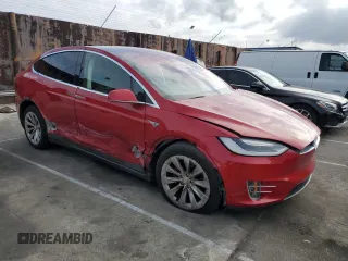 2016 Tesla Model X 70D with VIN 5YJXCAE28GF002399, listed as a Copart auction lot 50884225 with 73,113 mi miles and Salvage Title. Bid and sale history available at DreamBid. Image 4.