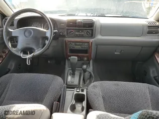 1998 Honda Passport LX with VIN 4S6CM58W2W4403473, listed as a Copart auction lot 66621474 with 154,892 mi miles and Clean Title. Bid and sale history available at carsss.com. Image 8.