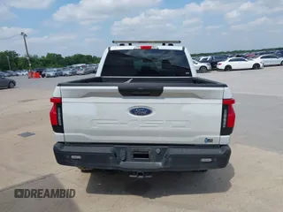 2023 Ford F-150 Lightning Pro with VIN 1FTVW1EL2PWG18764, listed as a IAAI auction lot 41908278 with 16,276 mi miles and . Bid and sale history available at DreamBid. Image 16.