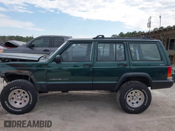 1999 Jeep Cherokee Sport with VIN 1J4FF68S1XL555463, listed as a IAAI auction lot 41898076 with 206,656 mi miles. Bid and sale history available at carsss.com. Image 14.