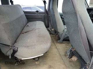 1995 Ford Econoline Wagon XL z VIN 1FBJS31H6SHB90674, wystawiony jako Copart lot #56070895 z przebiegiem 329 012 mil mil oraz Szkoda całkowita • Salvage title. Historia ofert i sprzedaży dostępna na DreamBid. Obrazek 11.