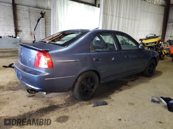 2003 Kia Spectra GS z VIN KNAFB161135104592, wystawiony jako Copart lot #52097205 z przebiegiem 119 206 mil mil oraz Szkoda całkowita • Salvage title. Historia ofert i sprzedaży dostępna na DreamBid. Obrazek 3.