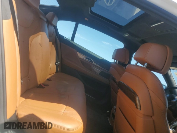 2018 BMW 7 Series 740i xDrive with VIN WBA7E4C52JGV24125, listed as a Copart auction lot 48164214 with 77,695 mi miles. Bid and sale history available at carsss.com. Image 10.