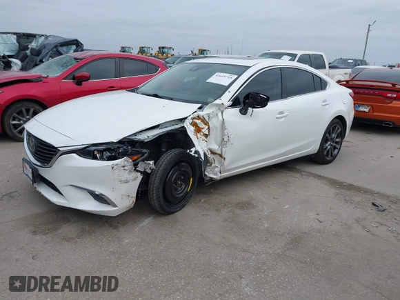 2017 Mazda 6 Grand Touring with VIN JM1GL1W57H1126716, listed as a IAAI auction lot 41619715 with 105,332 mi miles and . Bid and sale history available at DreamBid. Image 22.
