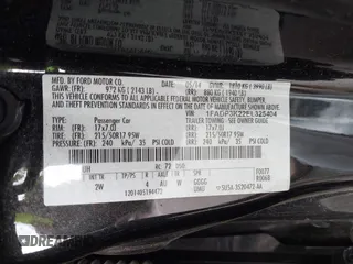 2014 Ford Focus SE with VIN 1FADP3K22EL325404, listed as a IAAI auction lot 42060162 with 115,265 mi miles. Bid and sale history available at carsss.com. Image 9.