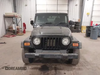 2006 Jeep Wrangler Sport Right Hand Drive with VIN 1J4F449S56P741328, listed as a IAAI auction lot 41476847 with 67,203 mi miles. Bid and sale history available at carsss.com. Image 12.