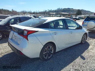 2021 Toyota Prius L Eco with VIN JTDKAMFUXM3142402, listed as a IAAI auction lot 41665484 with 67,416 mi miles. Bid and sale history available at carsss.com. Image 4.