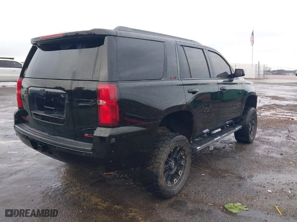 2016 Chevrolet Tahoe LT with VIN 1GNSKBKC1GR217818, listed as a IAAI auction lot 41012345 with 122,696 mi miles. Bid and sale history available at carsss.com. Image 4.
