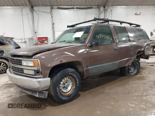 1994 GMC Suburban with VIN 1GKEC16K1RJ738915, listed as a IAAI auction lot 41717424 with 173,338 mi miles. Bid and sale history available at carsss.com. Image 2.