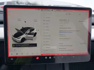 2023 Tesla Model Y Long Range with VIN 7SAYGAEE8PF706706, listed as a IAAI auction lot 41297340 with 24,428 mi miles and . Bid and sale history available at DreamBid. Image 19.