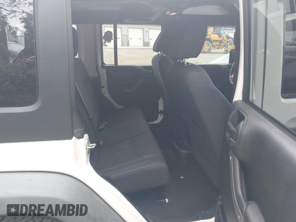 2014 Jeep Wrangler Unlimited Sport with VIN 1C4BJWDG9EL135077, listed as a IAAI auction lot 42324775 with 104,221 mi miles and . Bid and sale history available at DreamBid. Image 8.