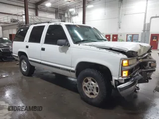 1996 Chevrolet Tahoe z VIN 1GNEK13R5TJ341299, wystawiony jako IAAI lot #41713489 z przebiegiem 251 990 mil mil oraz . Historia ofert i sprzedaży dostępna na DreamBid. Obrazek 1.