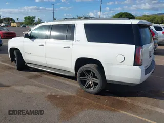 2015 GMC Yukon XL SLT with VIN 1GKS1HKC2FR612690, listed as a IAAI auction lot 41234188 with 113,830 mi miles. Bid and sale history available at carsss.com. Image 3.