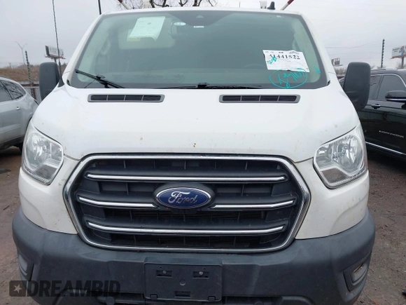 2020 Ford Transit Cargo z VIN 1FTBR1Y86LKA30515, wystawiony jako IAAI lot #41441522 z przebiegiem 84 331 mil mil oraz . Historia ofert i sprzedaży dostępna na DreamBid. Obrazek 12.